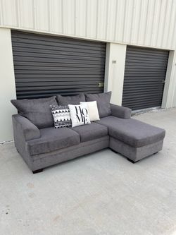 Gray Reversible Sectional Couch. Delivery Available!