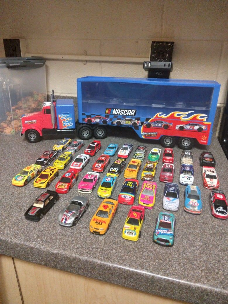 NASCARS AND TRUCK CAR HAULER