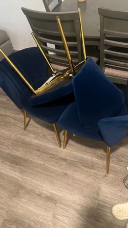 3 blue velvet chairs