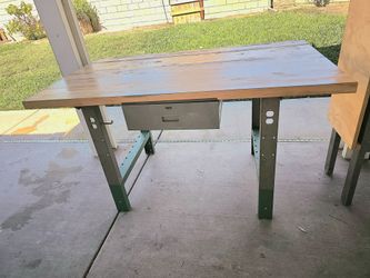 Heavy duty work bench with thick acacia top.