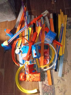 Several Hot Wheels Tracks and Cars