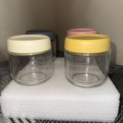 4 cute glass jars with colorful lids