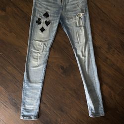 Solitaire Stacked Skinny Jeans - Medium Wash Unique distressed denim jeans with black and white playing card patches