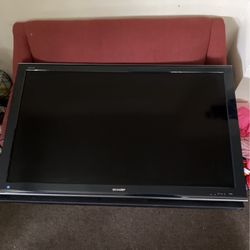 Sharp Aquos Tv 55” Inch Black With Speaker Board Attached. 