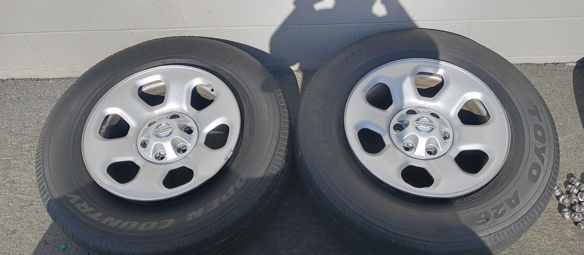(4) Nissan Titan / Armada Original Steel Wheels Rims + Caps 18"