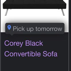 black couch folding into futon