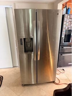 LG Stainless Steel side by side fridge- barely used!!