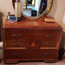 Waterfall dresser with deco mirror, chest of drawers,  and armor 