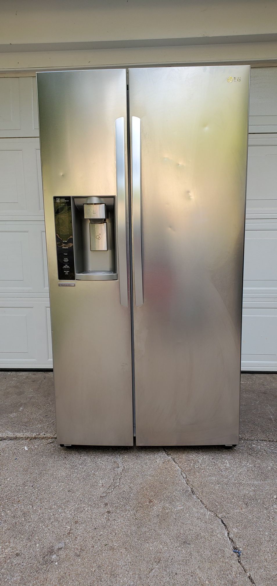 LG stainless steel 26.2 cu. ft. side by side refrigerator with in-door ice maker.