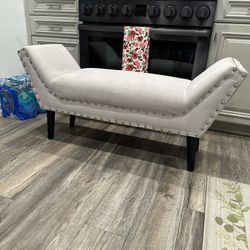 Beautiful Light Gray Suede Bench With Nail Button Trim And Wooden Legs