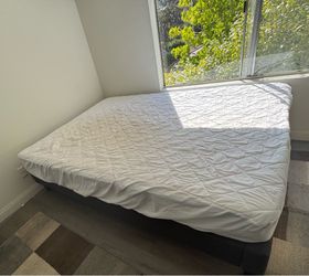 Queen size bed with mattress and protector