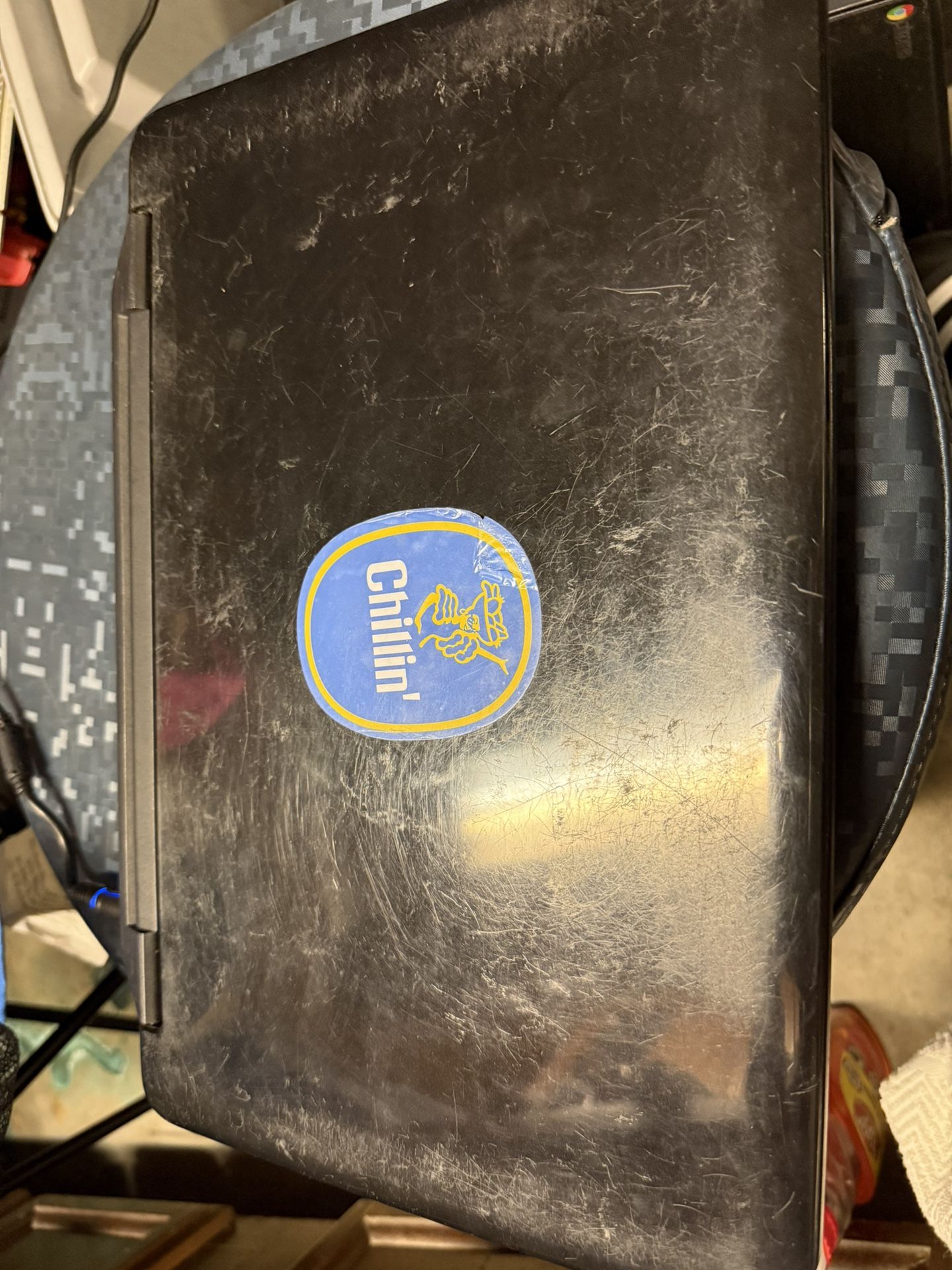 Dell Inspiron laptop with charger  As seen in the picture it’s working but needs to be reformat