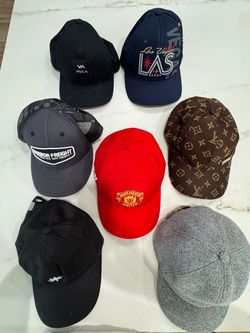 A collection of seven assorted baseball caps