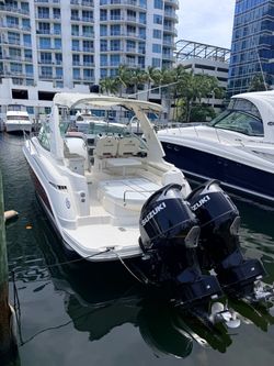 White Bowrider Boat with Twin Suzuki Outboards 350