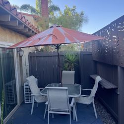 Patio Table, chairs,  and umbrella 