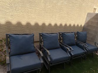 Set of 4 Outdoor Patio Chairs with Cushions Also a gas fire pit.
