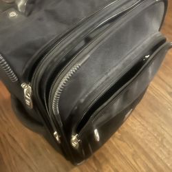 Small travel bag on wheels all zippers works asking 25 cleaning out for new years very sturdy 