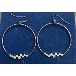 Silver Toned dangle earrings with rhinestones.