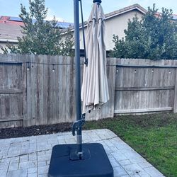 Free Umbrella stand with sandbags (Umbrella is ripped)