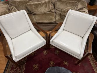 Two white wood chairs
