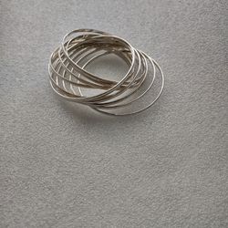 Silver-tone bracelet, 12 intertwined pulses,