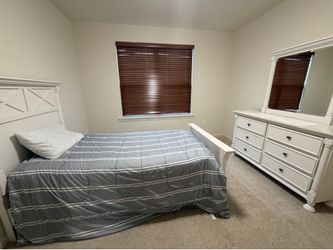 Twin bed with mattress and boxspring, plus a six drawer dresser and mirror
