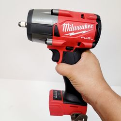 Milwaukee M18 FUEL impact wrench. This is the 3/8" friction ring mid-torque model, 2960-20. Tool only, no battery or charger. Has some light scuffs.