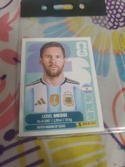 Selling a Messi World Cup sticker.