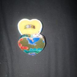 925 Sterling Silver With Five Stones In It