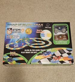 NEW IN BOX  Snap N' Glow Trax Light Speedway Set.
