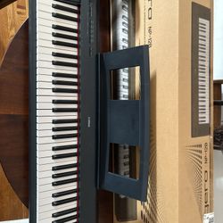 Yamaha Keyboard Piano (Piaggero NP-12B) w/stand + Rest