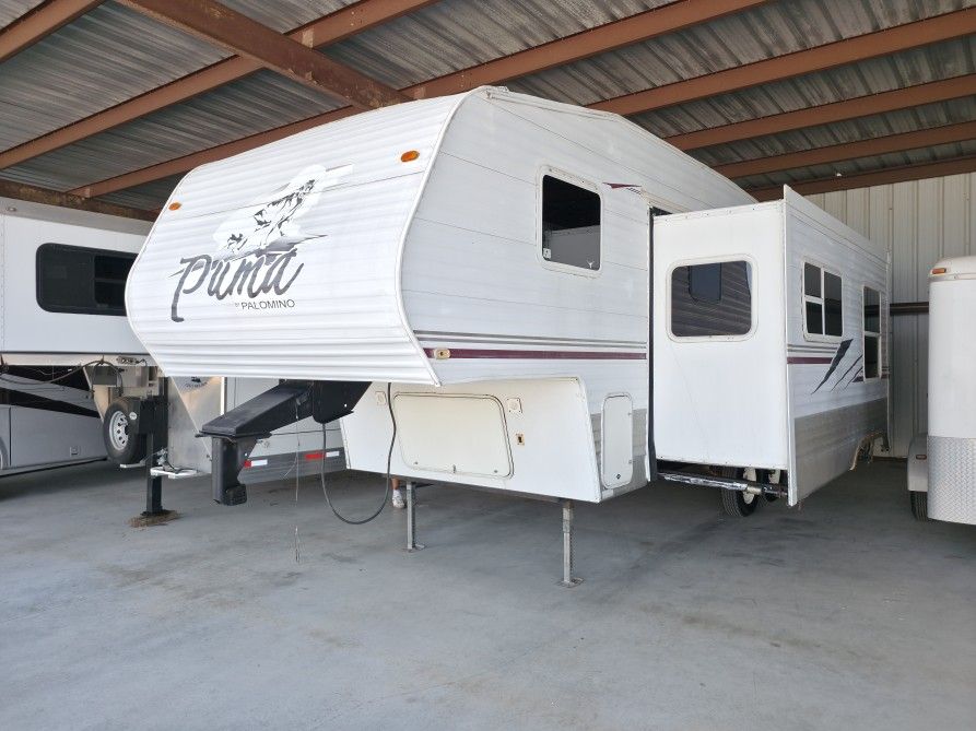 2006  Palomino by Forest River Puma 30FT super slide out sleep six people table and couch makes into a bed front.Queen bed, large kitchen,