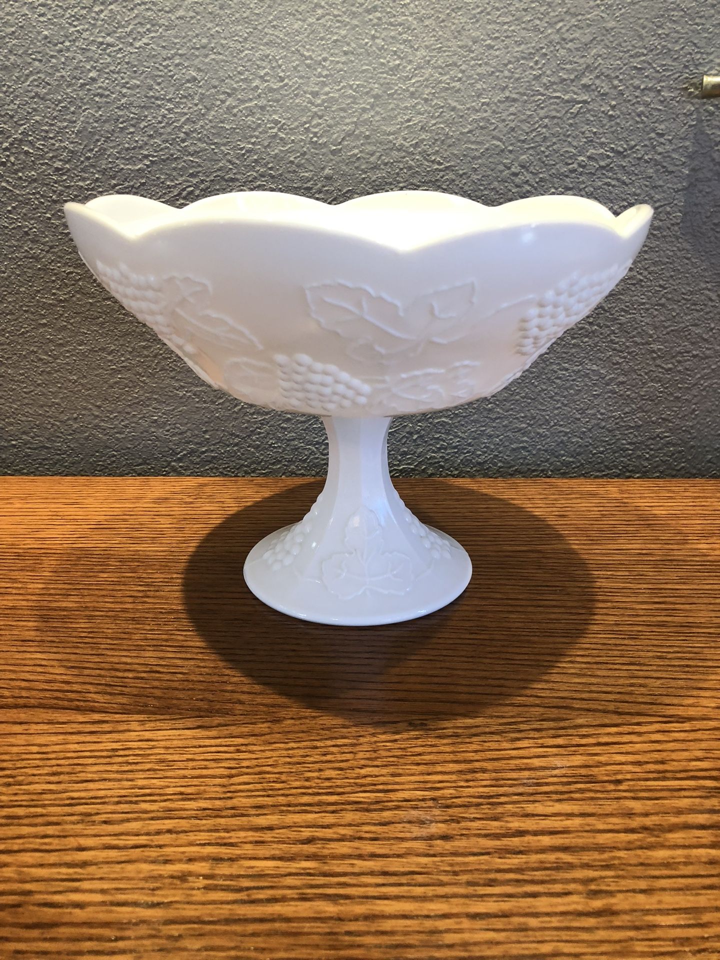 Vintage Antique Gorgeous Milk Glass Serving Pedestal Bowl.  Scalloped Rim And Grapes Decorated .  No markings or brand.  Size 10 inches wide across th