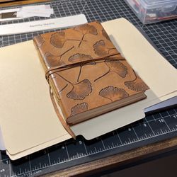 Leather bound Notebook with wrap-around strap 
