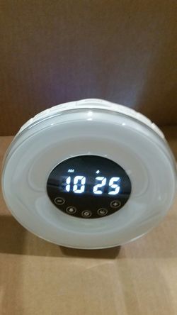 Digital alarm clock and night light with fm radio.
