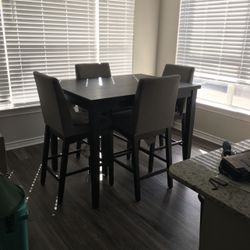 Black Bar-height Table With Grey Chairs