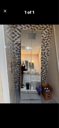 MIRRORED FOLDING DOOR. 23 1/2"w x 78 1/2" tall; cross streets are Arapaho & Waterview