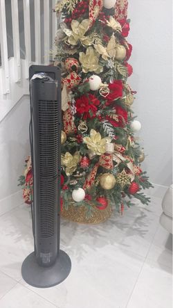 Lasko Black Tower Fan with Round Basea