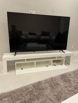 White glossy lacqer tv stand holds up to 80 inch tv