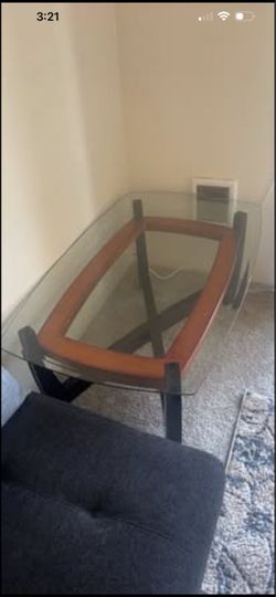 Glass top coffee table 50” x 30”