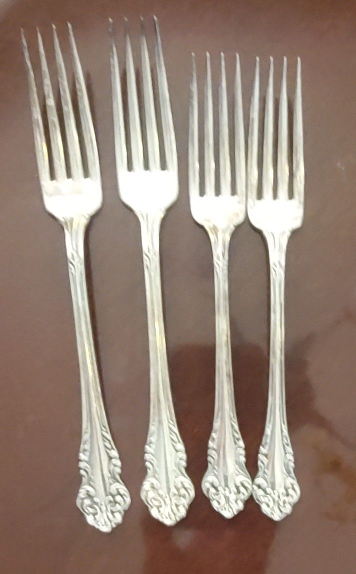 Four beautiful community silver triple plate forks