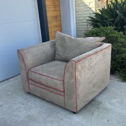 Oversized Tan Armchair With Red Detail