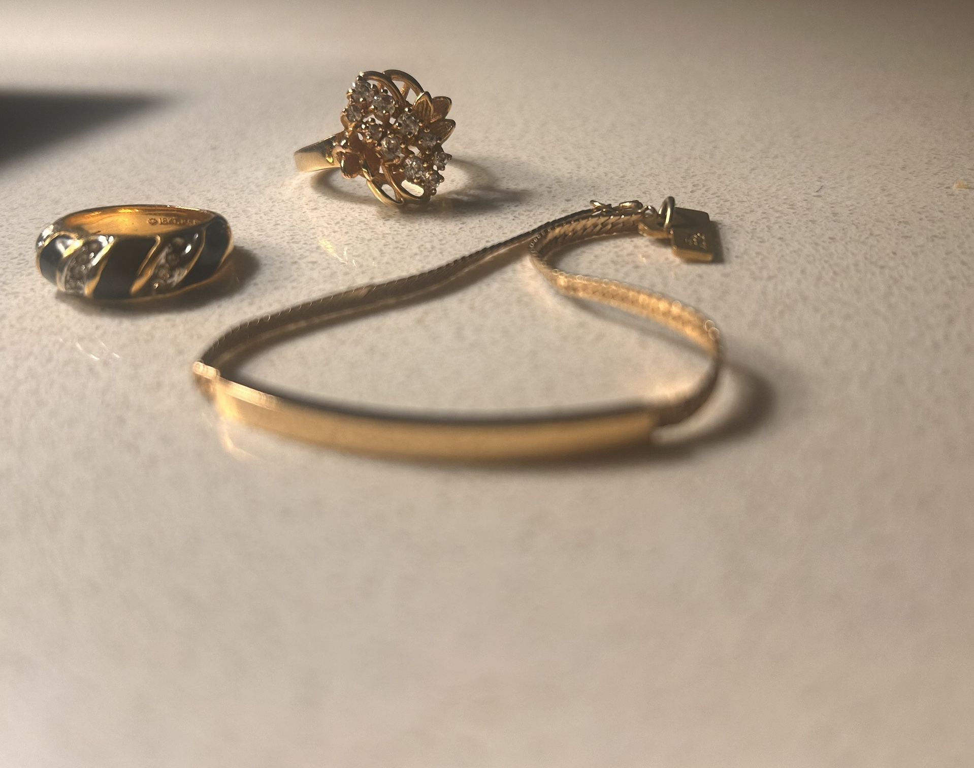 Gold bracelet and Rings