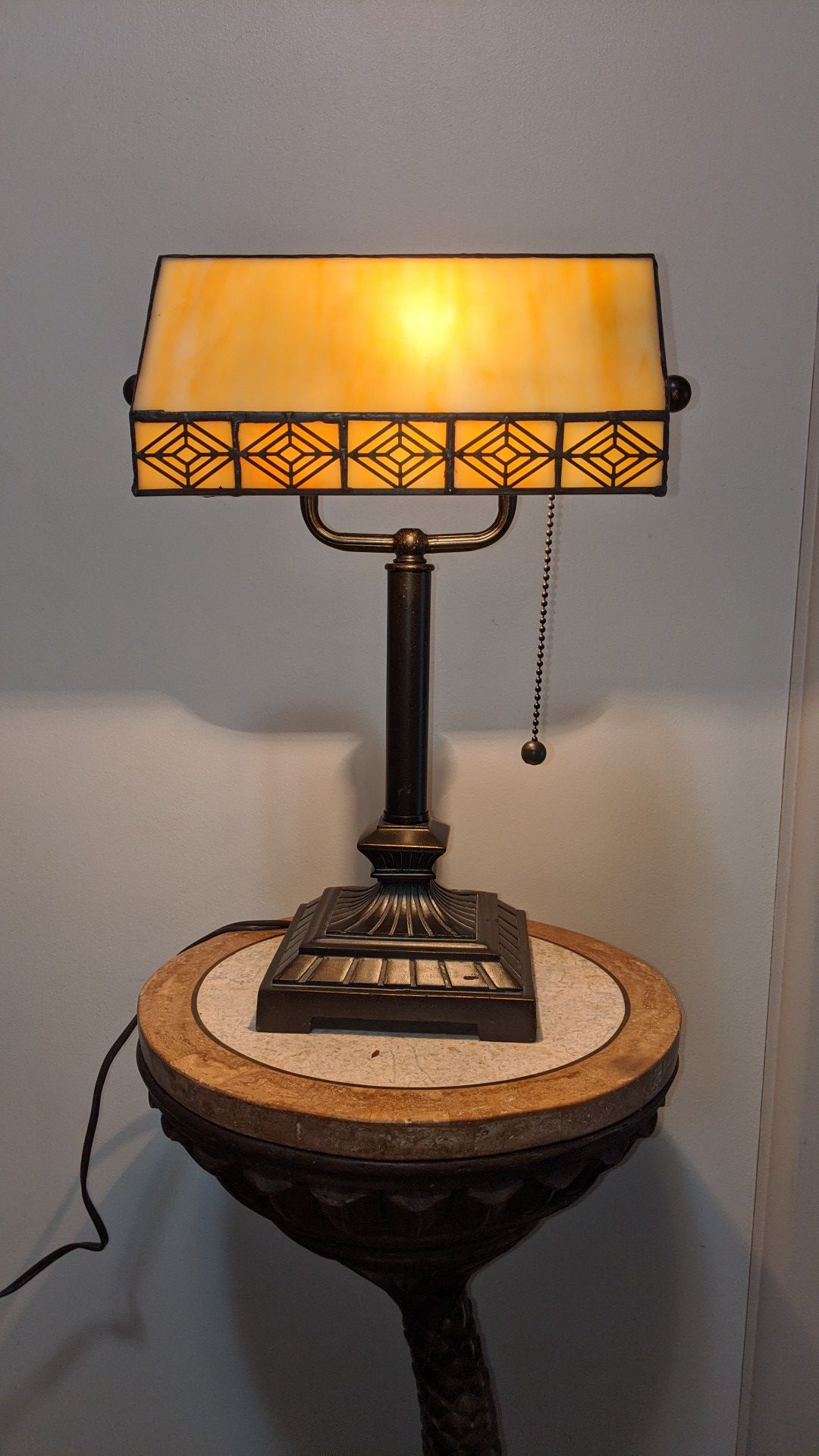Desk lamp with pivoting leaded glass shade