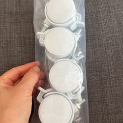 set of white caster wheels with brakes or locks
