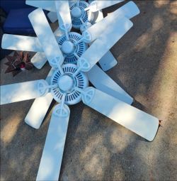 3 white Hampton bay AC fans
