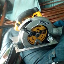 A DeWALT Circular Saw Model Number Dwe575 Sb7 1/4 Inch Next To Brand New