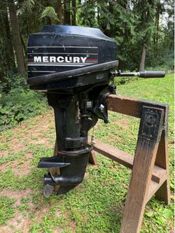 6 hp Mercury outboard with 2 tanks and hose