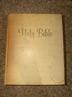 New American Bible published by The Catholic Press in Chicago. Has some writing in it & is discolored - see pics. Pages are in tact but bind is loose