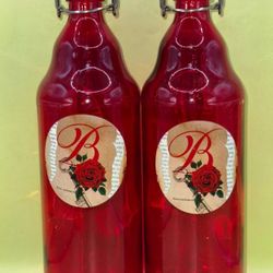 2 red fliptop BostonEvermore wine bottles